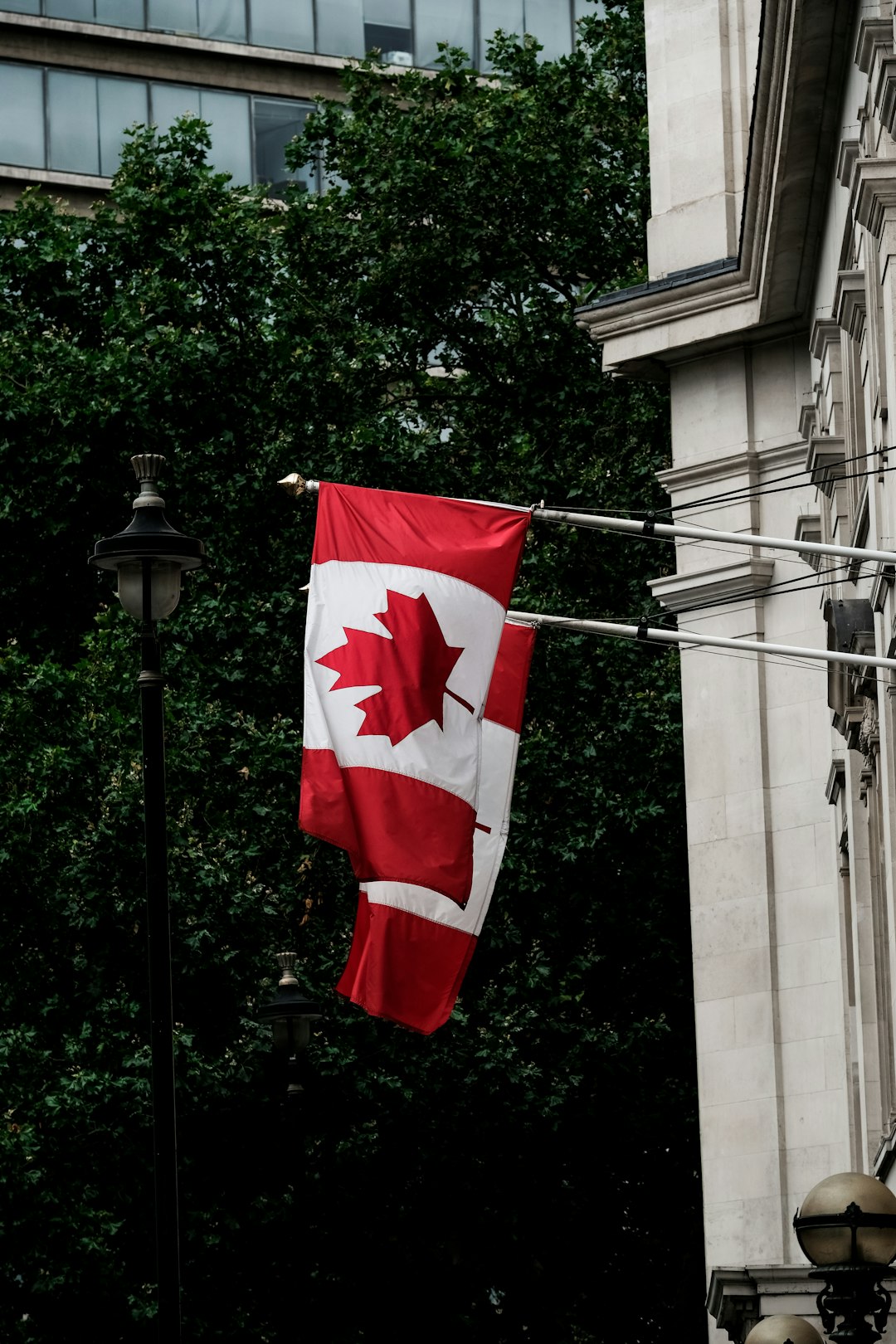Canadian flags hanging on the outside of the Canada House in Central London.