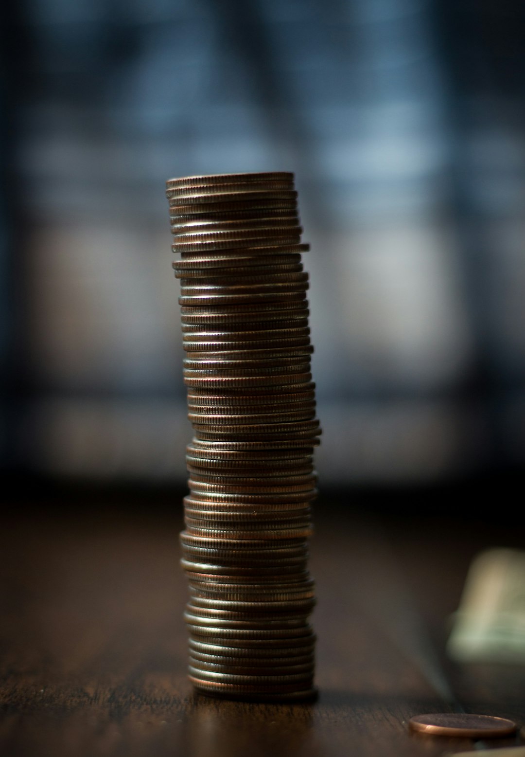 gold-round-coins-on-brown-wooden-table-otfnltw0lh4