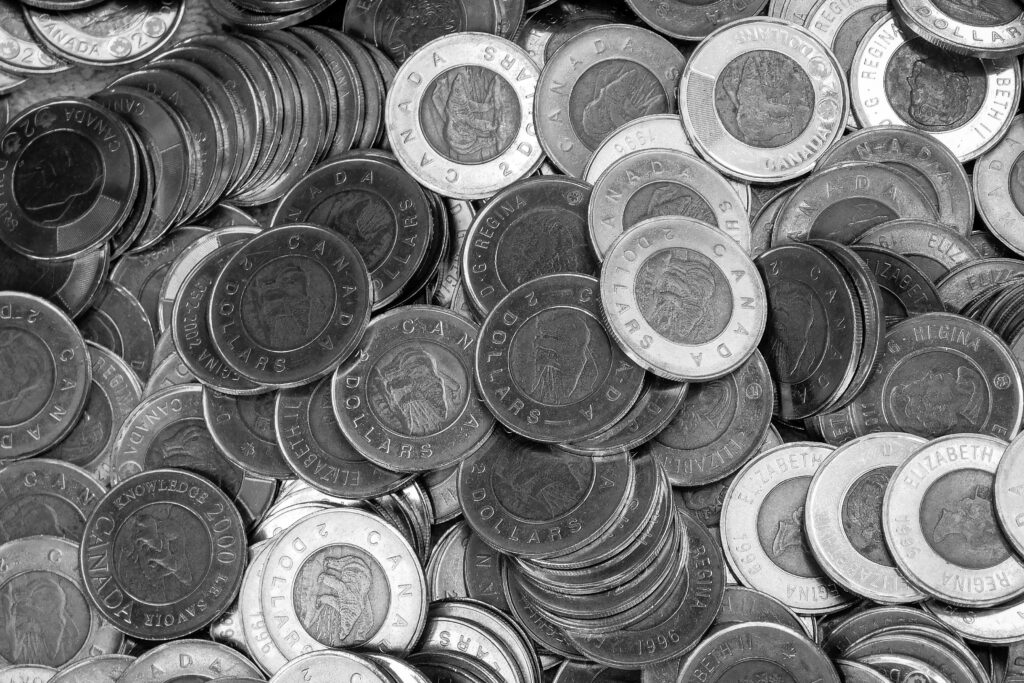Pile of Canadian two-dollar coins representing short-term borrowing and payday loan funds in Canada