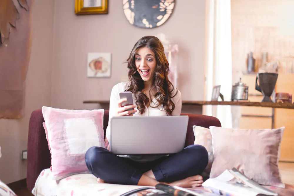 Person delighted after receiving a $300 no credit check loan by instant e-transfer in Canada
