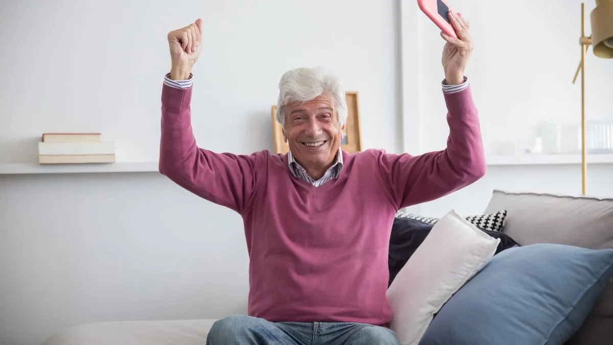 Man celebrating fast e-Transfer funding from an instant approval loan