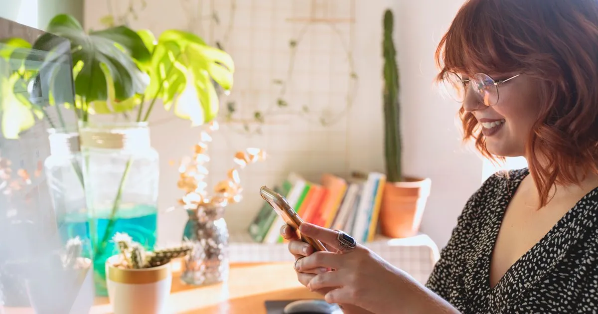 Woman checking instant approval loans on her phone in Canada