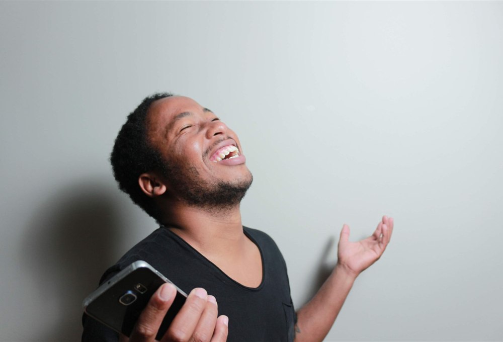 Canadian man happy after getting an instant no credit check loan approval on his phone