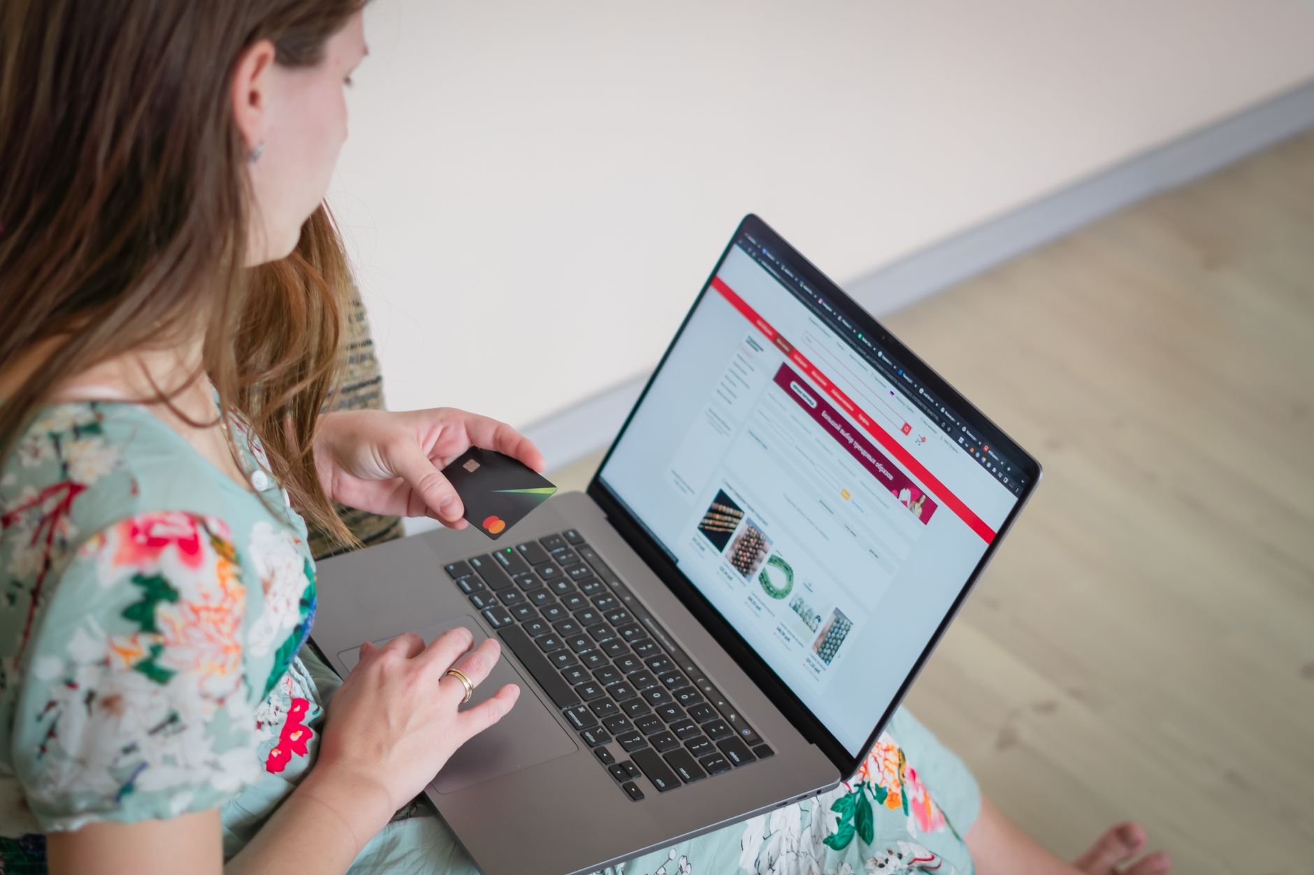 Woman shopping online with laptop and credit card - instant loans Canada