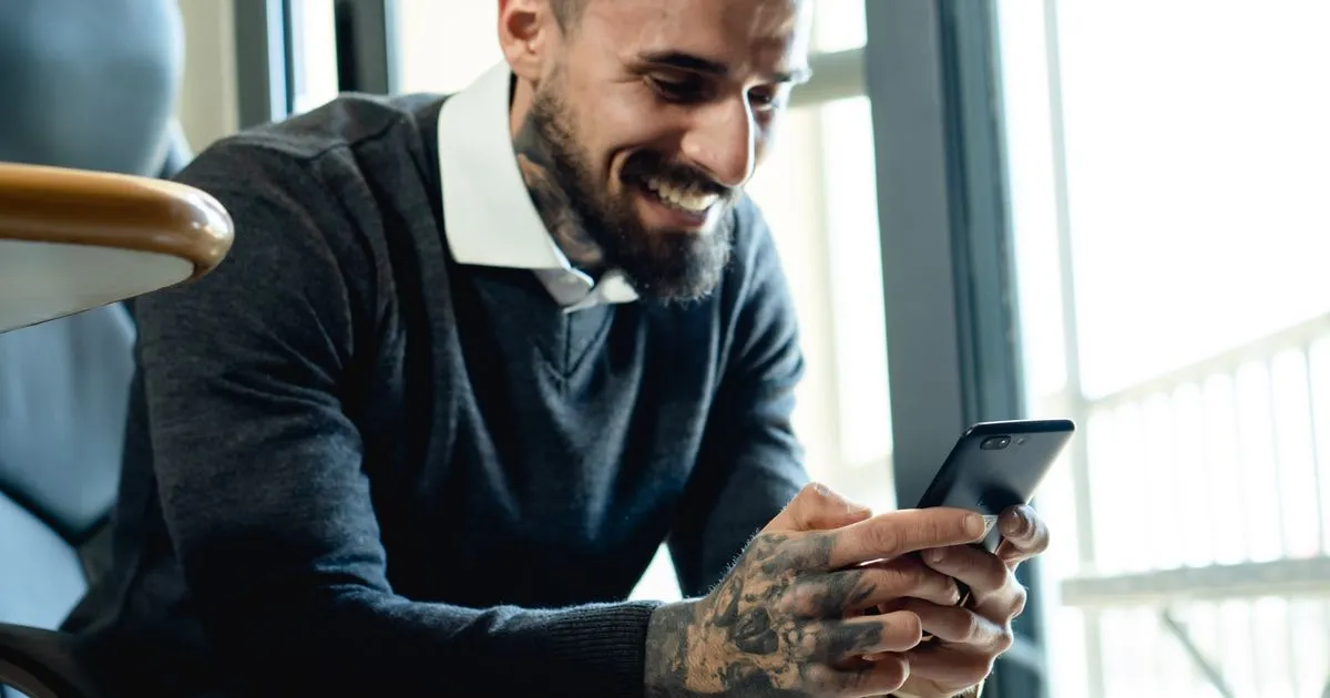 Man reading the decision on his $1500 no credit check loan application