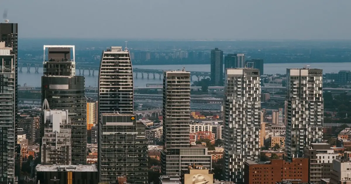 Instant loans Quebec - downtown Montreal towers with the Samuel De Champlain Bridge behind