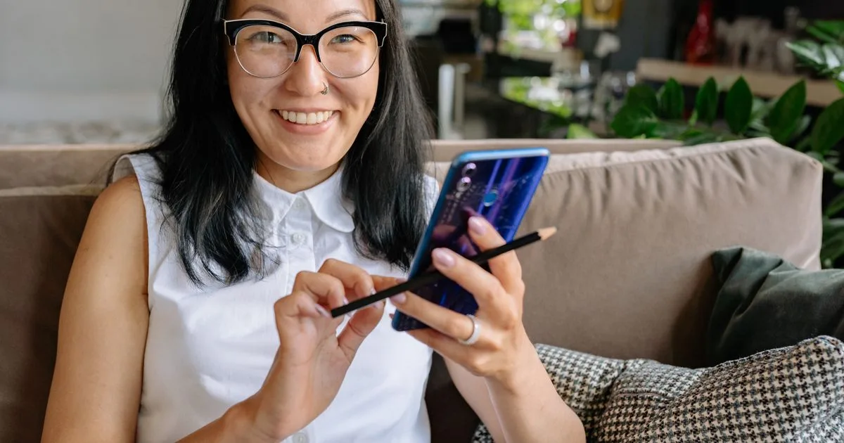 Toronto borrower getting a decision on no credit check loans Toronto lenders sent to her phone