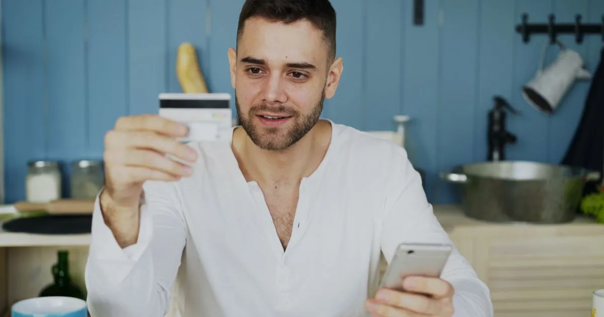 Applying for a $600 no credit check loan in Canada on a phone at home