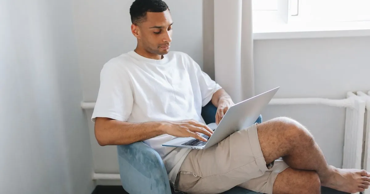 Borrower applying online for high risk loans from home on a laptop