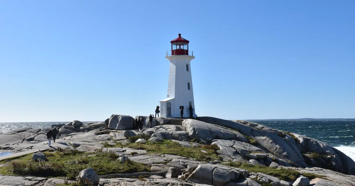 Instant loans Nova Scotia residents get online, with the Peggys Cove lighthouse on its granite shore