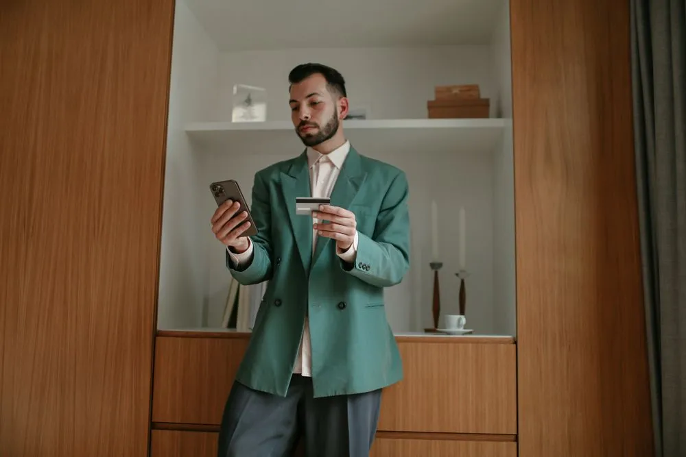 Canadian borrower checking a small loan offer on his phone